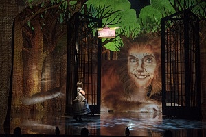 Tara Rosling as Alice Liddell and Jennifer Phipps as the Cheshire Cat in Alice in Wonderland.